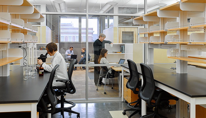Lab with Chadwick® High Task Chairs and adjacent charting area with MultiGeneration by Knoll® Stacking Chairs