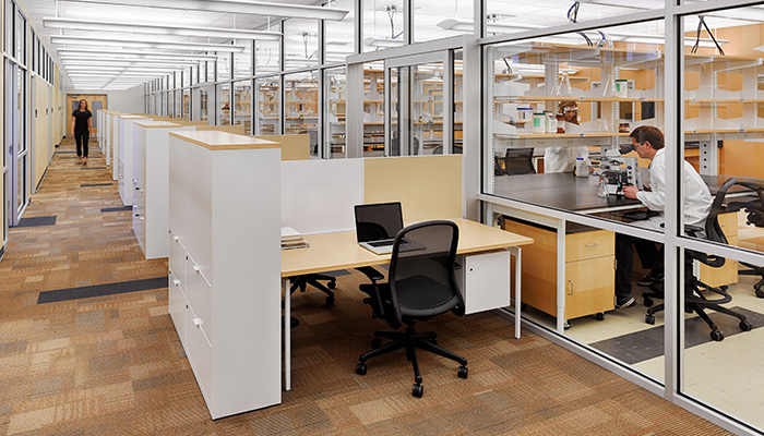 Research Lab with Chadwick High Task Chairs and administrative area in foreground with Antenna Workspaces® Stations, Template™ Storage and Chadwick® Task Chairs