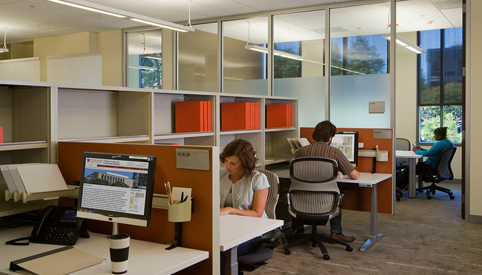 Shared open plan administrative area with Template® Storage and Generation by Knoll® Task Chairs